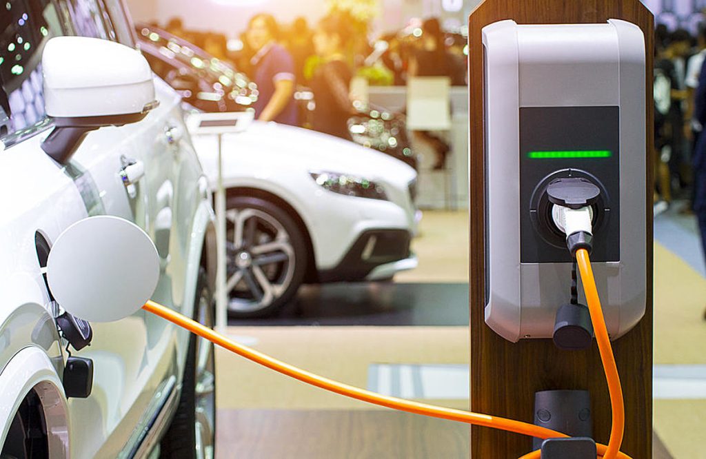 A close up of an electric car charging